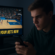 An adolescent focused on a phone as a sports betting promotion appears on a TV screen during a basketball broadcast